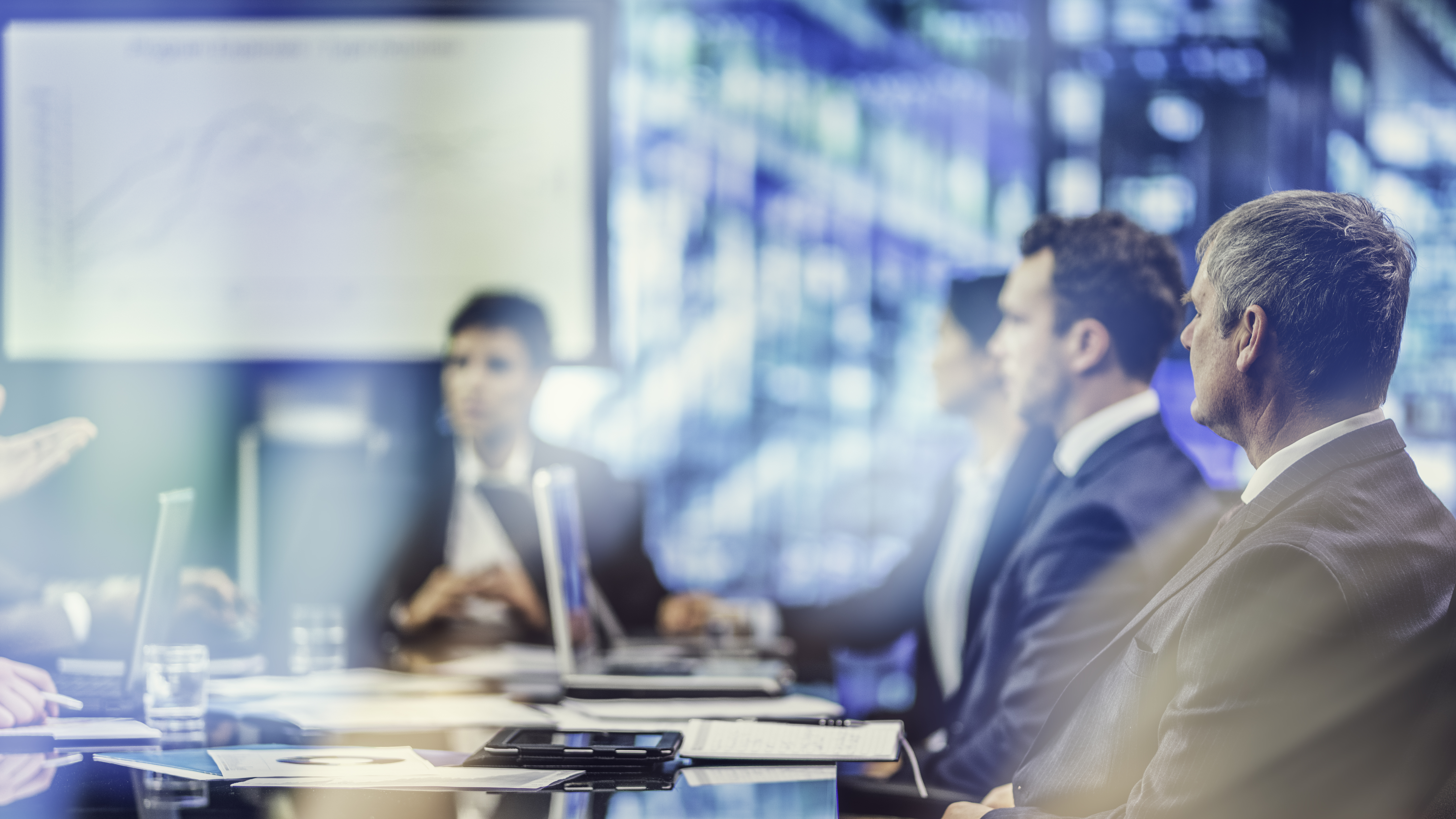 Executive technology leadership meeting in a modern setting